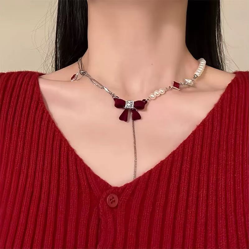 Red flocked bow necklace
