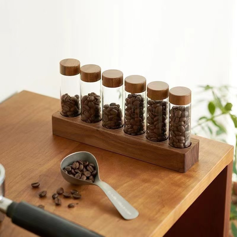 Cobertura de madera maciza de café, base de nogal de haya, subenvasado de granos de café, botella de vidrio, caja de almacenamiento, soporte de exhibición