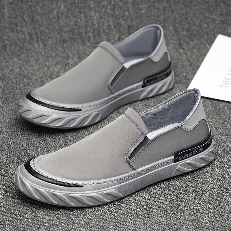 Zapatos de lona para hombres nuevos zapatos de trabajo negros simples de moda al por mayor.