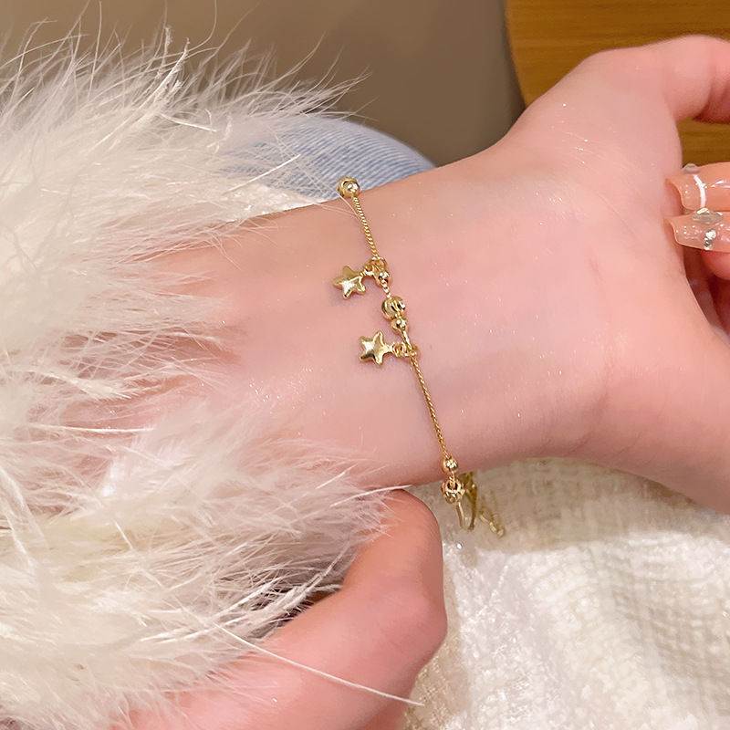 韓国の新しい真珠のブレスレットの小衆は高級感の精巧なジルコンの愛の手の串の気質の蝶結びのブレスレットを合わせます。