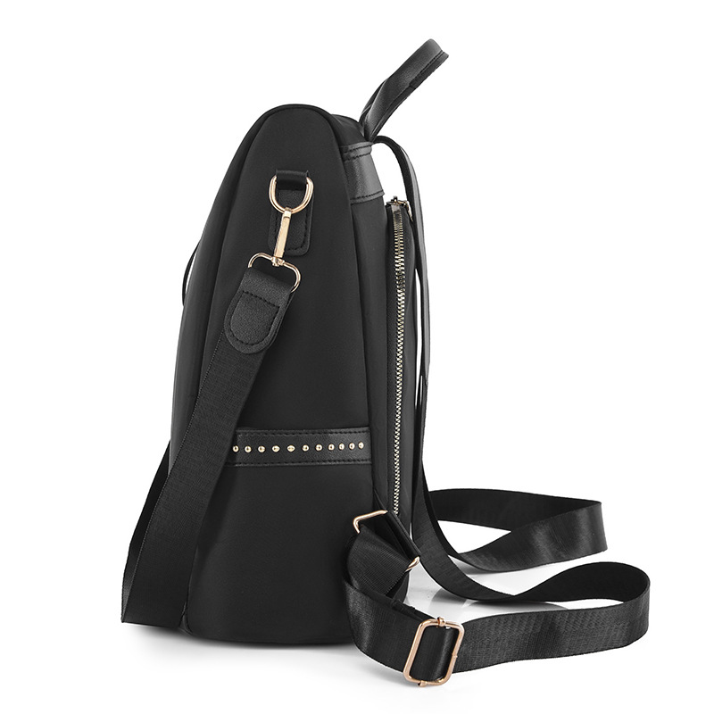 Venta al por mayor 2023 nuevo estilo casual mochila antirrobo mujer simple moda Oxford tela remache mochila escolar de doble uso