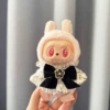 Pendant, golden trench coat