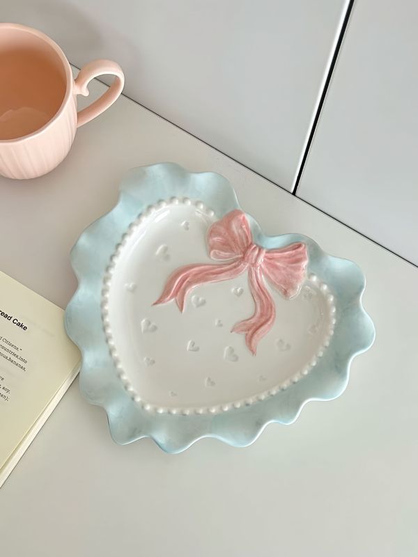 かわいい波の辺の蝶結びの愛の陶磁器のレースの食器の少女の心の家庭の茶碗の皿のドーパミンの食器|undefined
