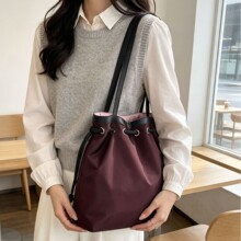 韩系撞色拼接水桶包女2026新款抽绳束口单肩包小众设计感手提包