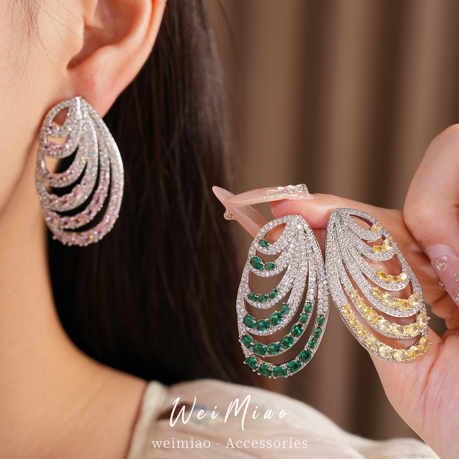 Aguja de plata zircon oval multicapa personalidad temperamento nicho pendientes de moda ligero lujo alta sensación auriculares al por mayor