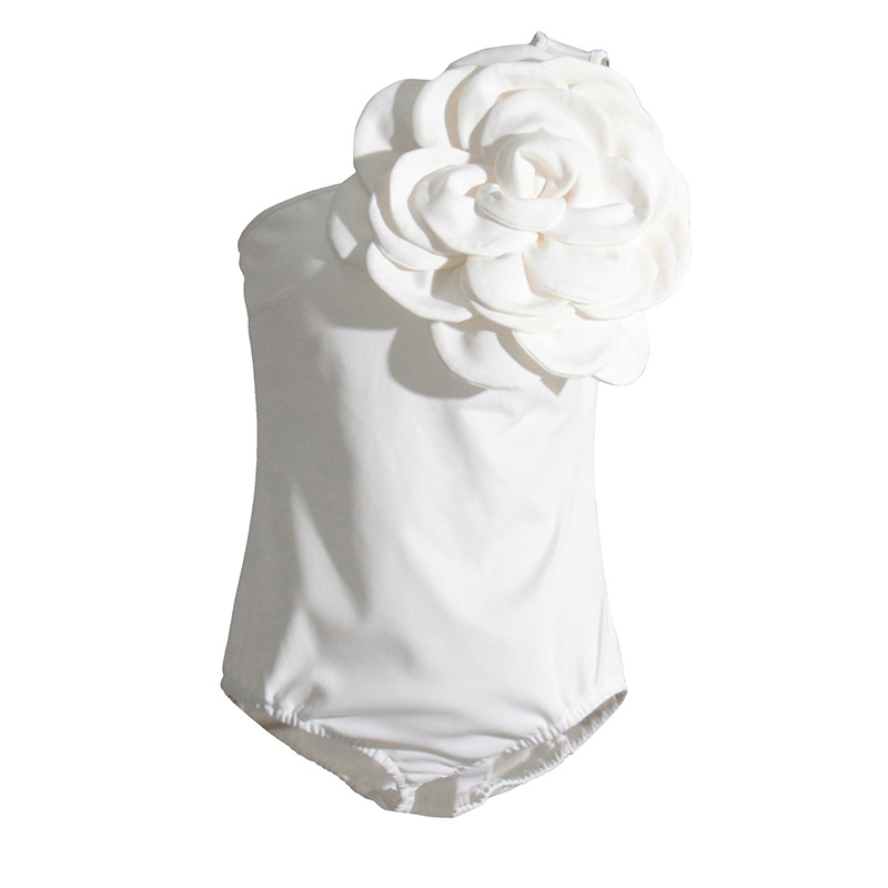 2024 verano nuevo europeo y americano hombro oblicuo diseño tridimensional flor costura sin mangas color sólido mono sexy moda ropa de mujer