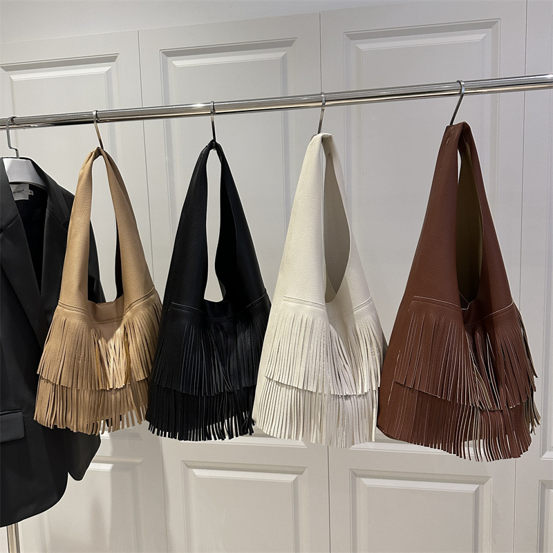 Bolsa coreana de bordas 2025, nueva moda de gran capacidad retro bolso de viaje relajado bolso axilar