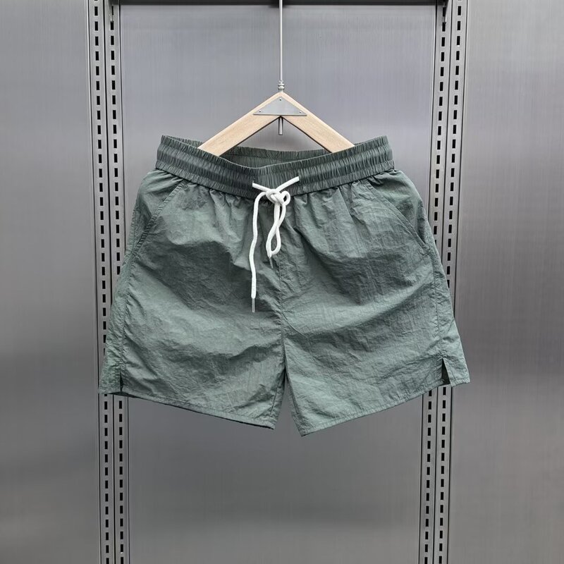 Summer Thin Ice Silk Quick-Drying Shorts for Men 2025 Trendy Casual Three-Quarter Pants Couple Drawstring Solid Color Beach Shorts Summer Thin Ice Silk Quick-Drying Shorts for Men 2025 Trendy Casual Three-Quarter Pants Couple Drawstring Solid Color Beach Shorts