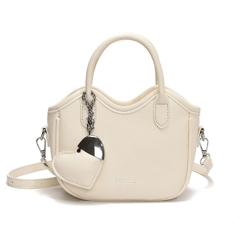 Bolsos pequeños de moda súper calientes de nicho para mujer 2025 nueva tendencia bolsa de cubo de aire extranjero estilo caliente de verano bolso de hombro de mano