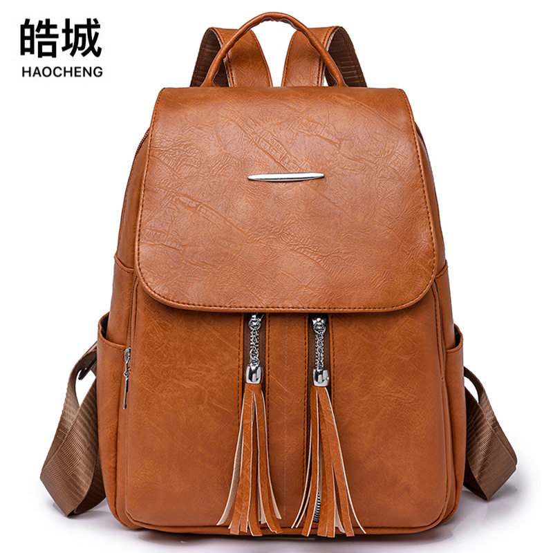 Comercio exterior al por mayor 2023 nueva mochila de cuero suave para mujer retro casual moda europea y americana