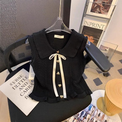 夏服の少女のニットの女性の波の紋様の黒い底のベストの外は蝶結びの気質の袖なしのtシャツの上着の薄いです。