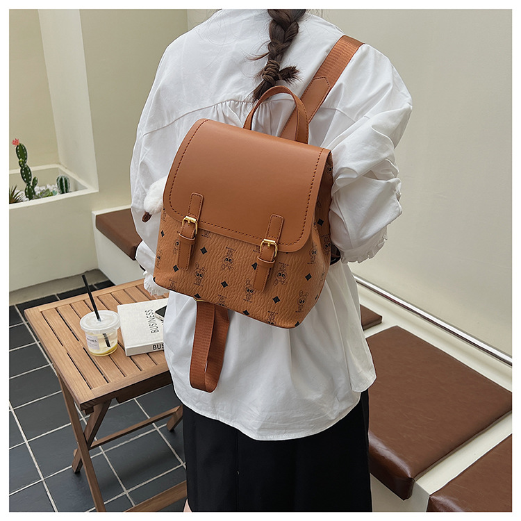 This is a niche design for women, featuring cartoon animal prints. It is a pink backpack with a high level of appearance and large capacity for travel undefined