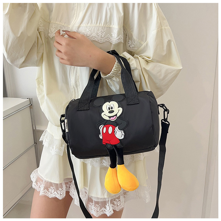 The 2021 new children's bags feature a cute Mickey Mouse pattern bowling bag for girls and a fashionable hand-held shoulder bag undefined