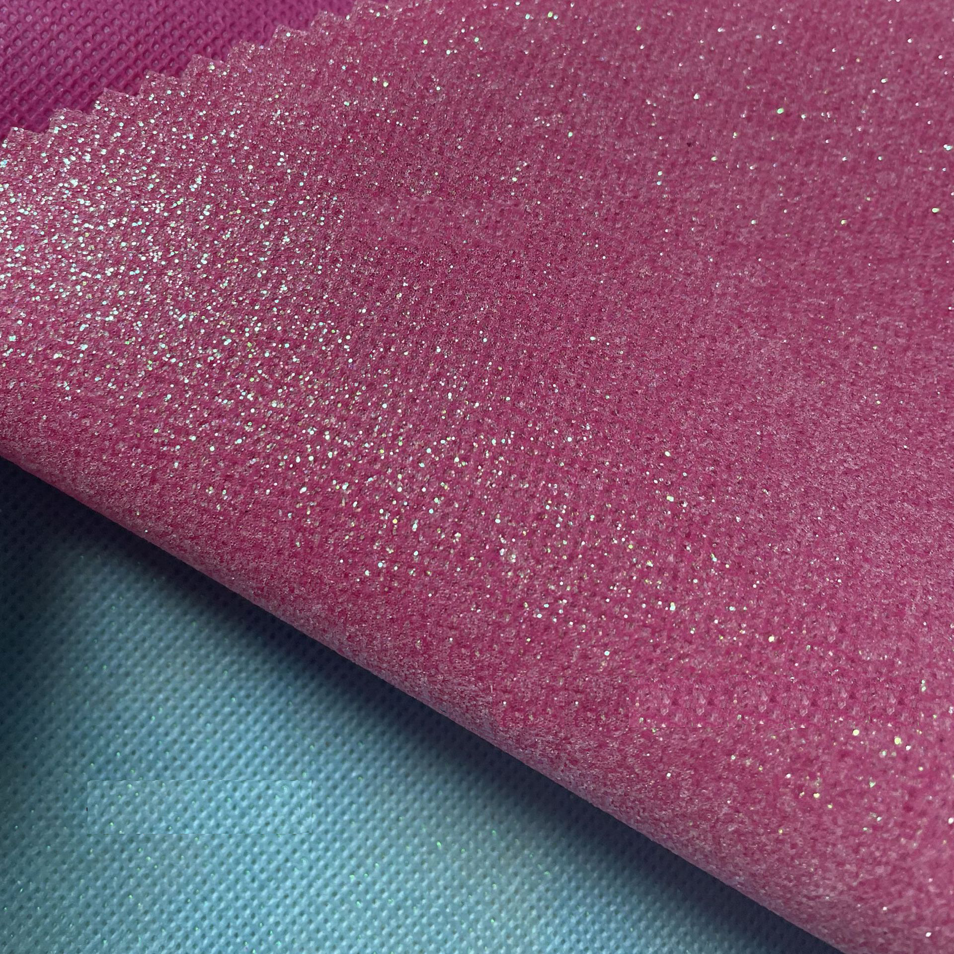 Suministro directo de fábrica de tela no tejida Glite Brillante Tela de lentejuelas Estuche para teléfono móvil Bolsa de cosméticos Accesorios para el cabello Decoración de ropa