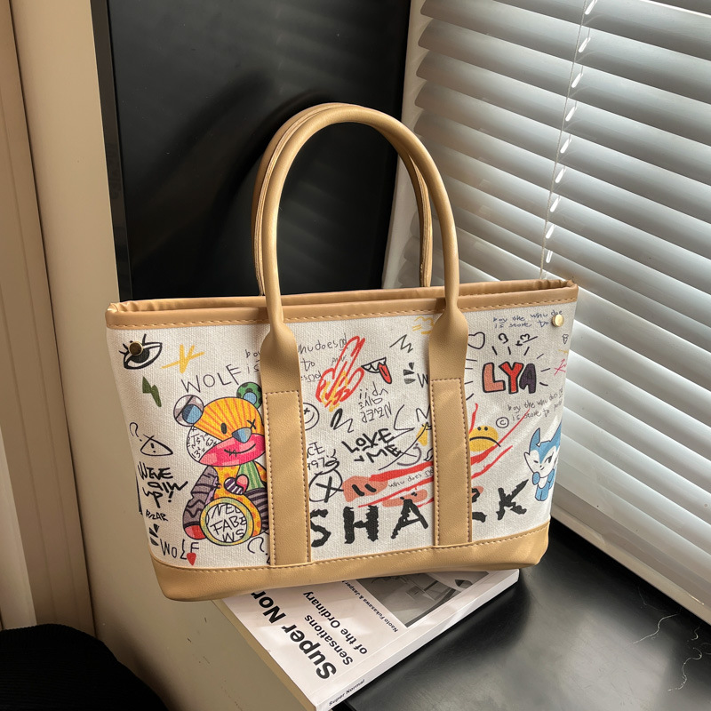 Invierno nuevo bolso de mujer personalidad graffiti portátil 2026 letras casuales Bear Tot bolso de cubo de hombro mochila