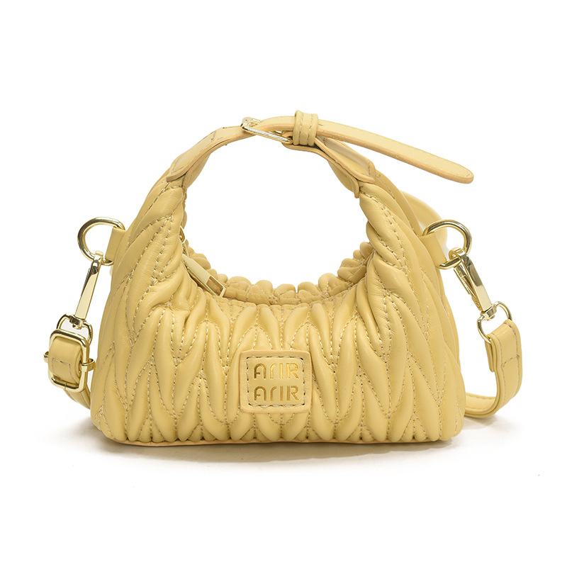 Bolsa de hombro de chicas plegadas de moda simple color sólido mini bolso de bebé 2025 nuevo bolso infantil transfronterizo