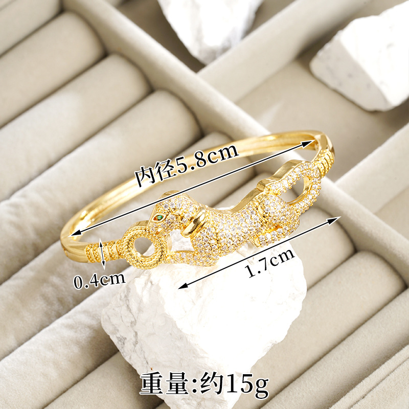 Nuevos productos de oro de arena galvanizado 18k pulsera de fijación ligera de lujo ojos verdes cabeza de leopardo hueco anillo de alquiler no se pierde joyería
