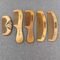 Natural wood comb made of peach wood, anti-static and massage-style, gentle on the scalp—cute little comb perfect for students.