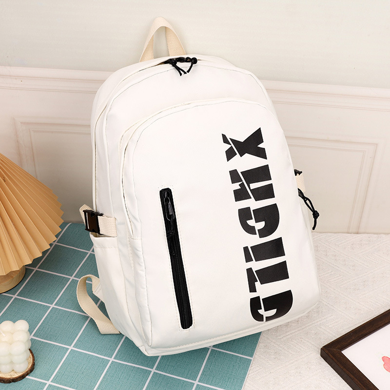 Mochila de moda de moda para hombres 2023 nueva mochila de hombro femenina de gran capacidad de letras de escuela secundaria mochila escolar