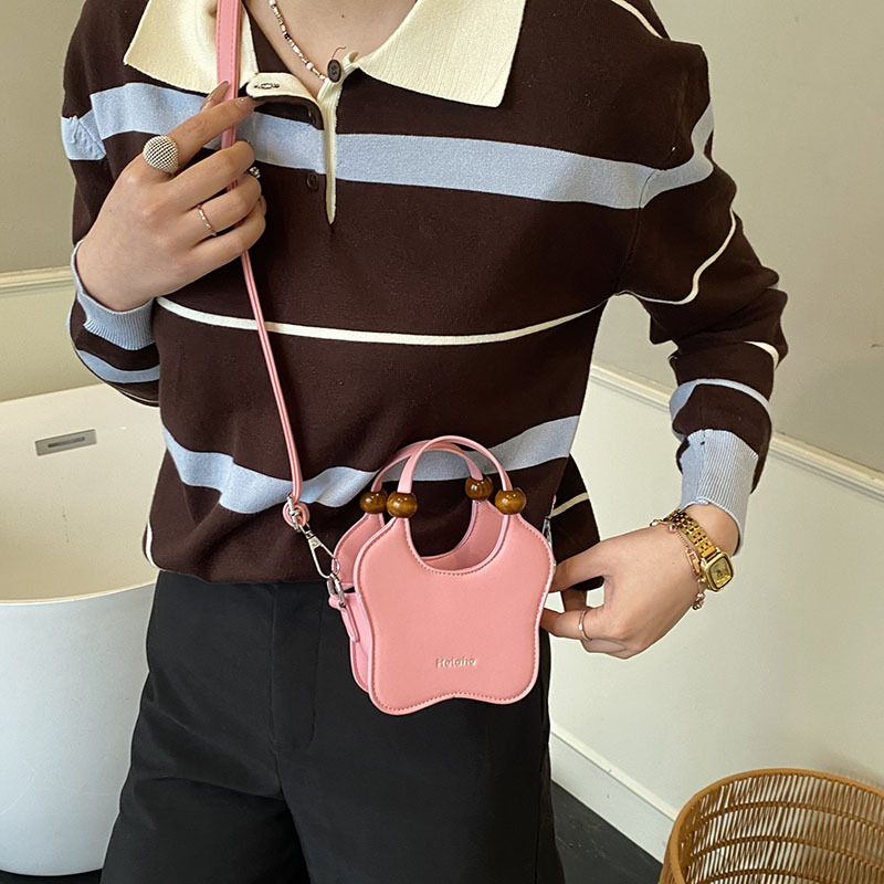 Bonita pequeña estrella en forma de bolso de hombro para niños y niñas, exquisita mini bolso de bebé, bolso para niños de comercio exterior transfronterizo