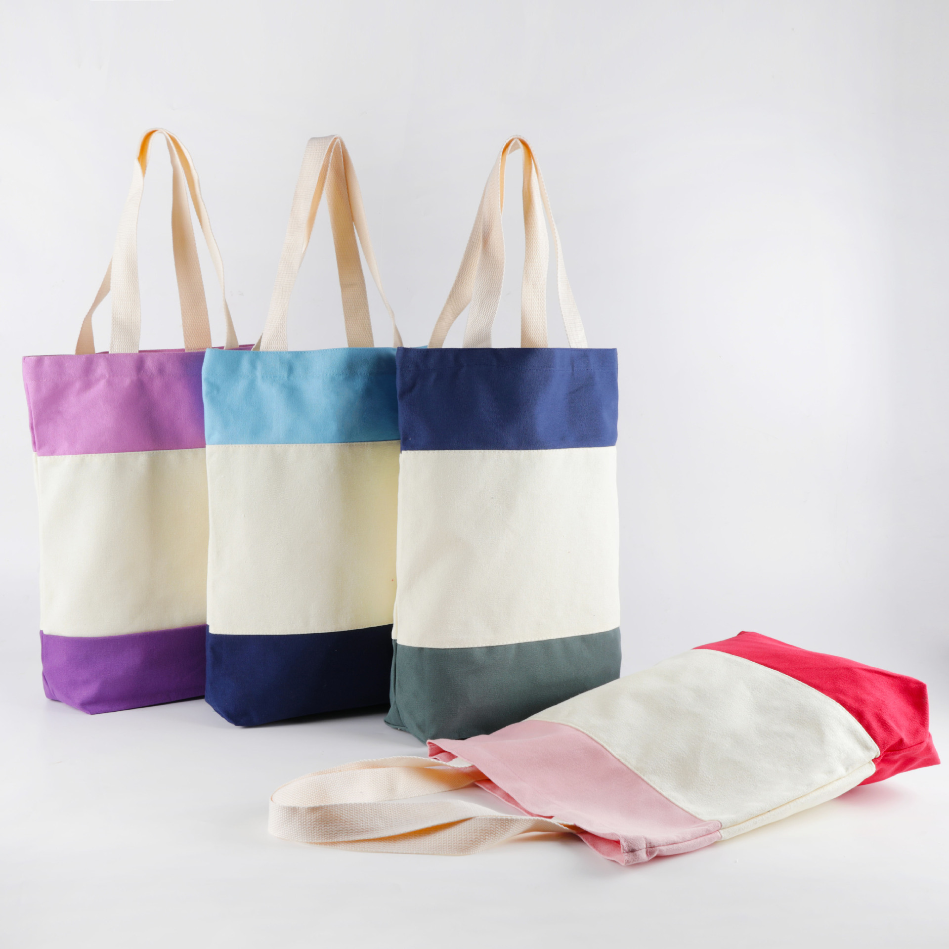 Fabricantes al por mayor bolsas de lona de algodón multicolor de costura de color estudiantes de moda de hombro bolsas de lona de mano bolsas de compras