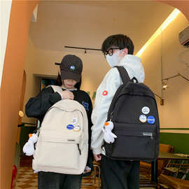 新款韩版简约勋章书包女初中生大学生双肩包男女时尚户外休闲背包