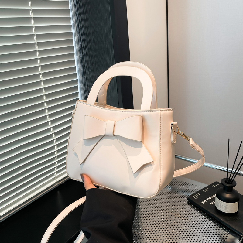 2025 primavera y verano nuevo color sólido bolso de hombro coreano bolso de mujer suave moda simple bolso de arco