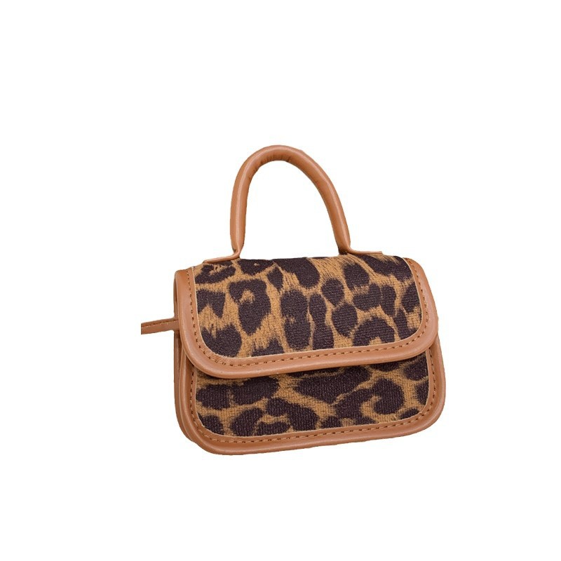 Moda coreana de leopardo para niñas bolso de hombro, bolso mini bebé de aire extranjero 2025 nuevo bolso de impresión para niños