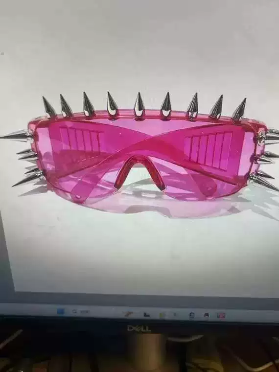 Sunglasses punk style, spike-studded fashion shades, black tinted lens