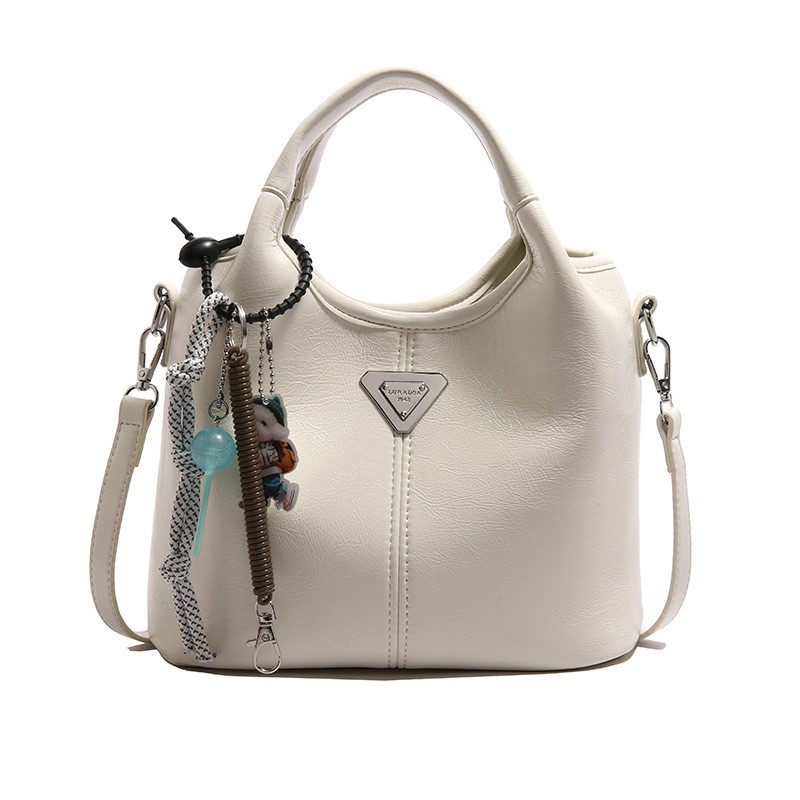 Bolsa de cubo de mano explosiva de comercio exterior para mujeres 2025 nueva moda bolsa de hombro ocio para viajar al trabajo de alta calidad bolsa madre