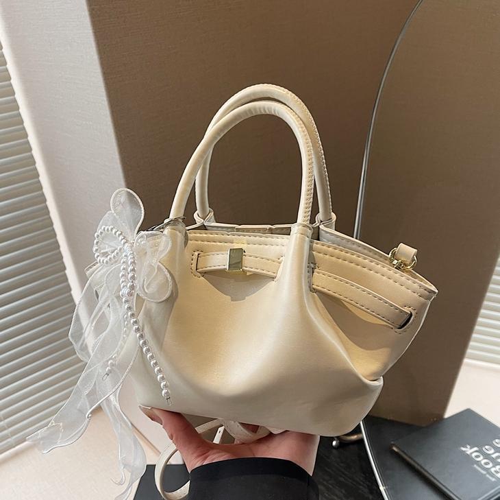 Nicho Zhong bolso de pulsera de brazalete para mujeres 2025, nuevo tipo de mochila de viaje, diseño de tendencia, bolso de cubo de alta calidad