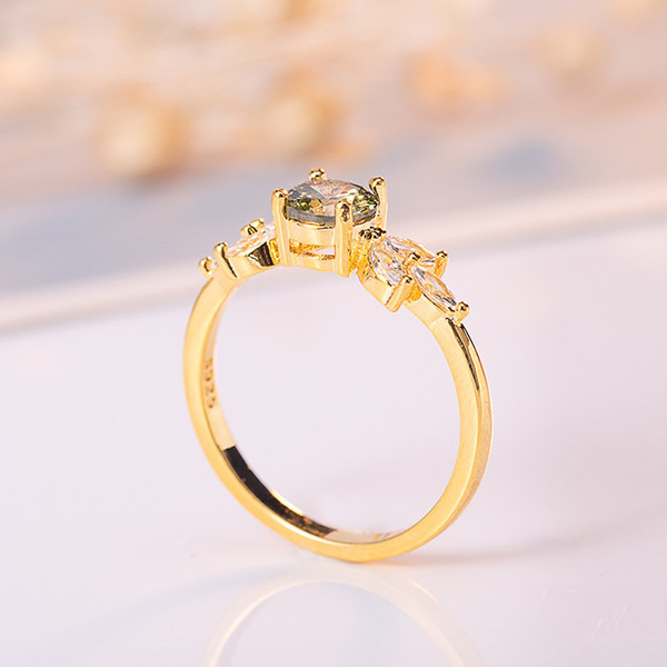 Golden ring with zircon