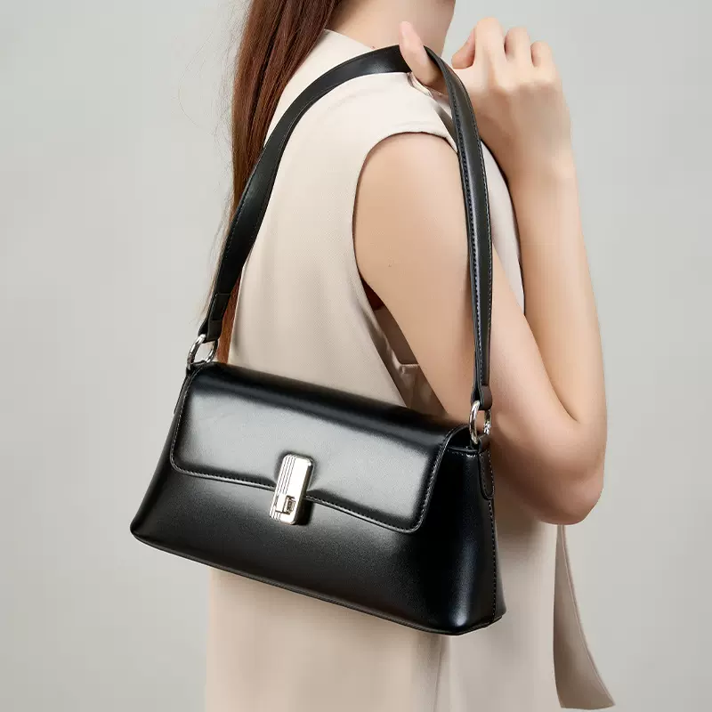 韩系女生黑色通勤斜挎女士单肩包真皮小众法式高级感法棍腋下包