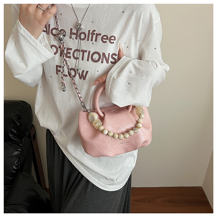 A stylish and trendy beaded bag for women, a new summer chain crossbody cloud bag for women in 2025 undefined