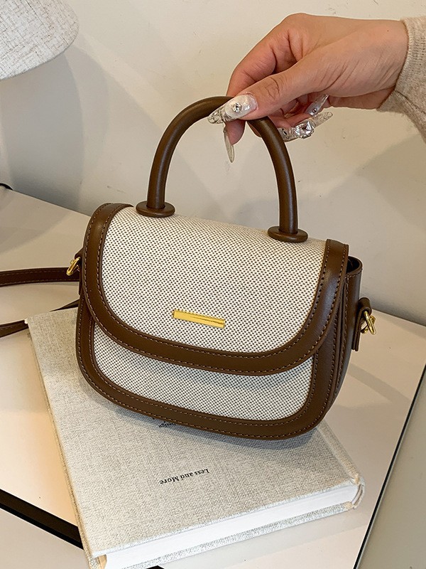 Bolsos de silla de mano de alta textura para mujeres 2026 nueva moda transfronteriza retro color contrastante empalme mochila de hombro