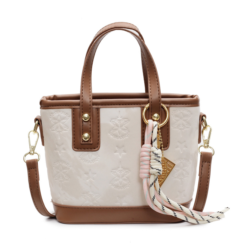 Bolso de mano popular, dama 2025, nuevo estilo de moda, bolso de hombro de color, bolso de cubo de alta calidad.