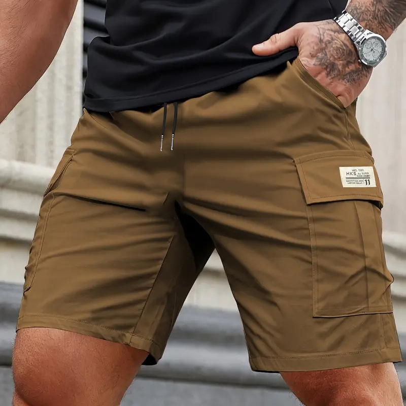 Pantalones cortos de trabajo de verano transfronterizos para hombres sueltos, secado rápido, pantalones casuales de cinco centavos de tamaño europeo, pantalones de bolsillo recto resistentes al desgaste