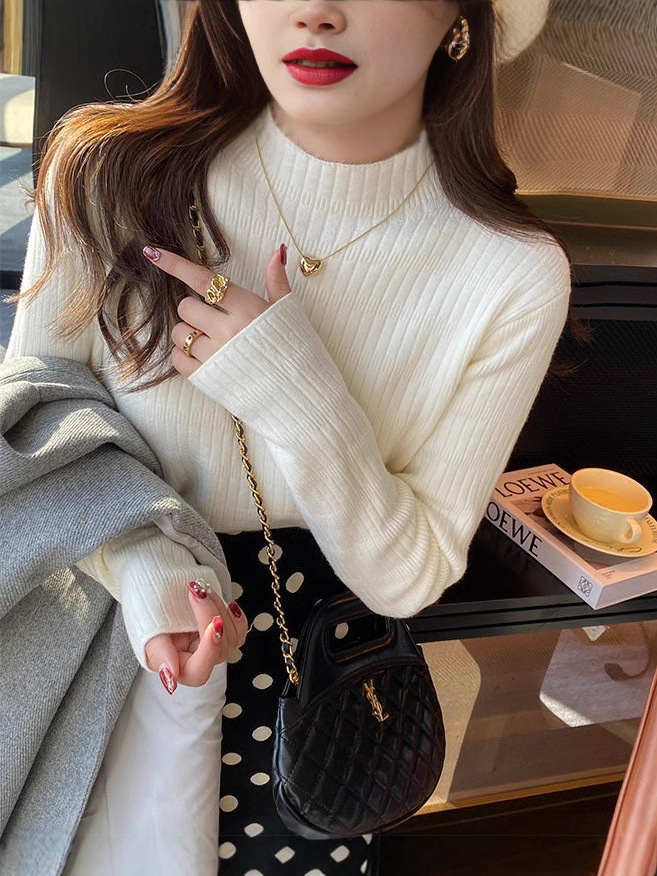 Otoño y invierno nuevo estilo coreano versátil camiseta de base de cuello medio alto con una camiseta de lana de color sólido y suéter de punto de lana para mujeres