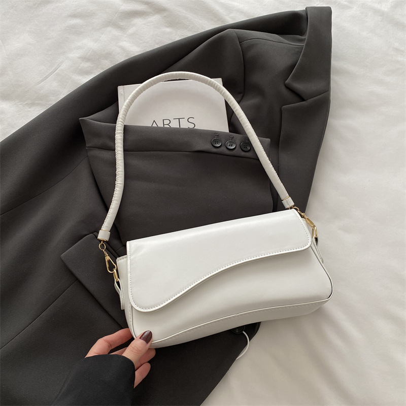 Bolso debajo de la axila para mujeres 2025 primavera nueva moda de alta sensación de hombro mochila de nicho bolso de textura cuadrada