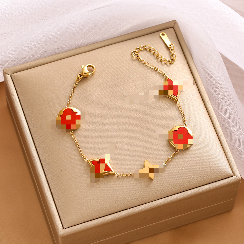 Pulsera de trébol de acero titanium vendedora caliente transfronteriza europea y americana con incrustaciones de concha pulsera colgante pulsera de diseño avanzado sin desvanecimiento al por mayor