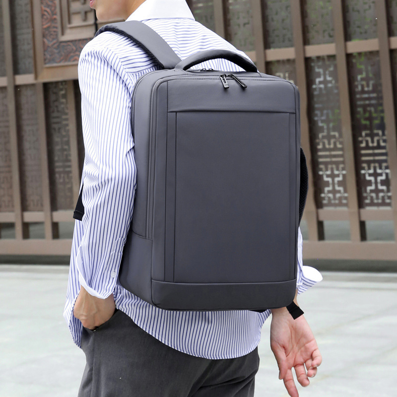 New men's minimalist laptop backpack, suitable for daily commuting, water-resistant, outdoor travel, and as a college student schoolbag.