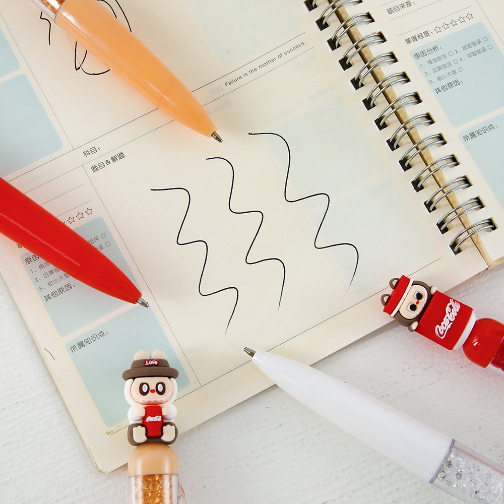 Caricaturas pequeñas Buda soda bolígrafo neutro de alto valor facial grano de aluminio suave diamante flash bolígrafo azul de comercio exterior artículos de papelería para estudiantes