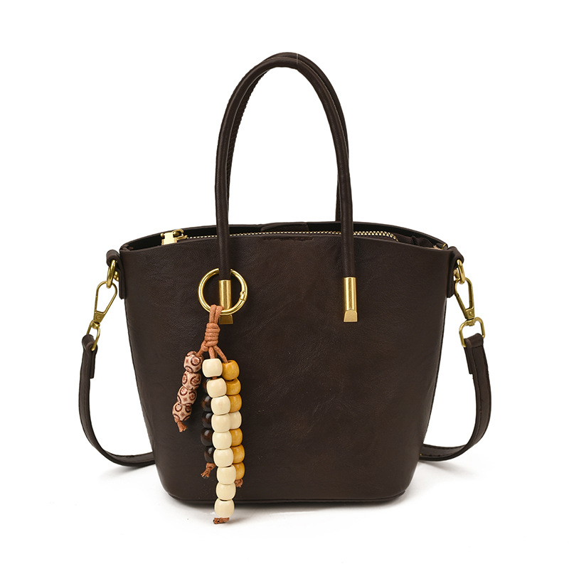 Bolsa de mano de textura retro de gran capacidad para mujeres otoño y invierno 2025 nuevo tipo de mochila de transporte público bolsa de hombro universal