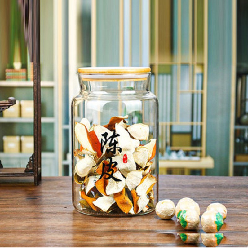 Fábrica al por mayor tarro de vidrio tarro de cáscara de mandarina pequeño verde naranja tarro de té grande tarro de almacenamiento tarro de vegetales en escabeche granos de almacenamiento