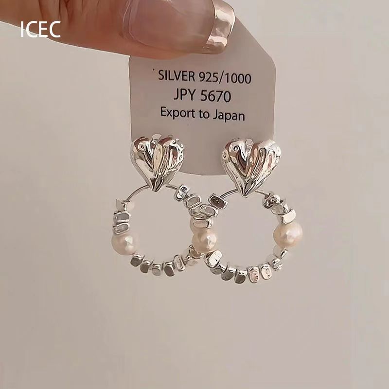 フランス式の清冷感の銀色の金属のイヤリングの真珠のドリルのフリンジデザイン感の耳飾りのファッションの高い顔の値の女性の耳飾り