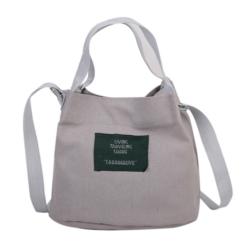 Bolso de mujer nuevo estilo coreano simple bolso de lienzo de chicas fresco de color sólido bolso de cubo de moda moda bolsa de mochila casual