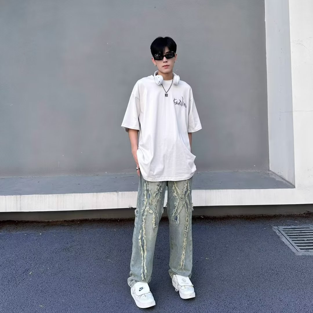 American High Street vintage jeans hombres Vibe desgastado parche diseño de pierna ancha pantalones casuales Pantalones rectos sueltos moda