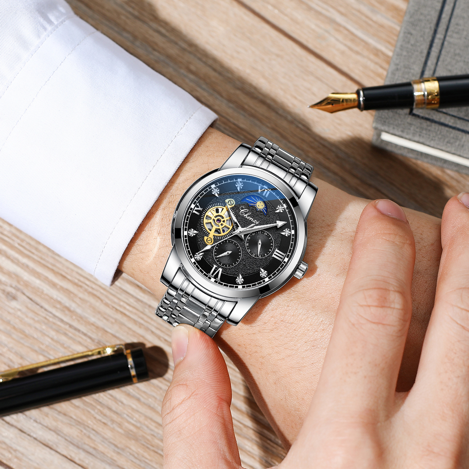 CHENXI reloj casual reloj mecánico automático de los hombres fase lunar nueva mariposa hebilla correa de acero hueco-hacia fuera transparente inferior