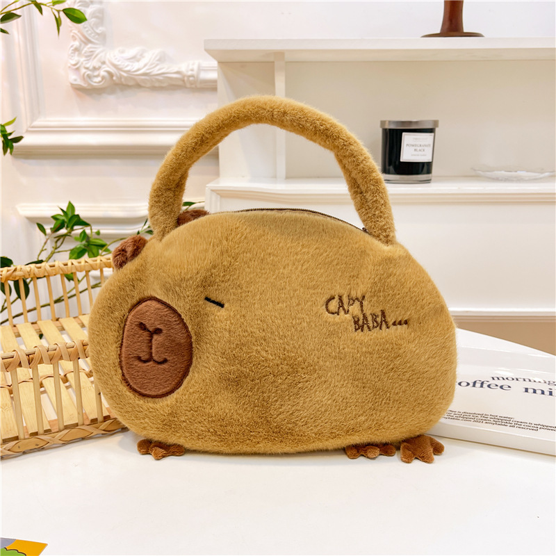 Bolso de peluche en línea para mujeres 2025 nuevo bolso de muñeca Capibara, bolso de cubo de mano lindo corazón de niña