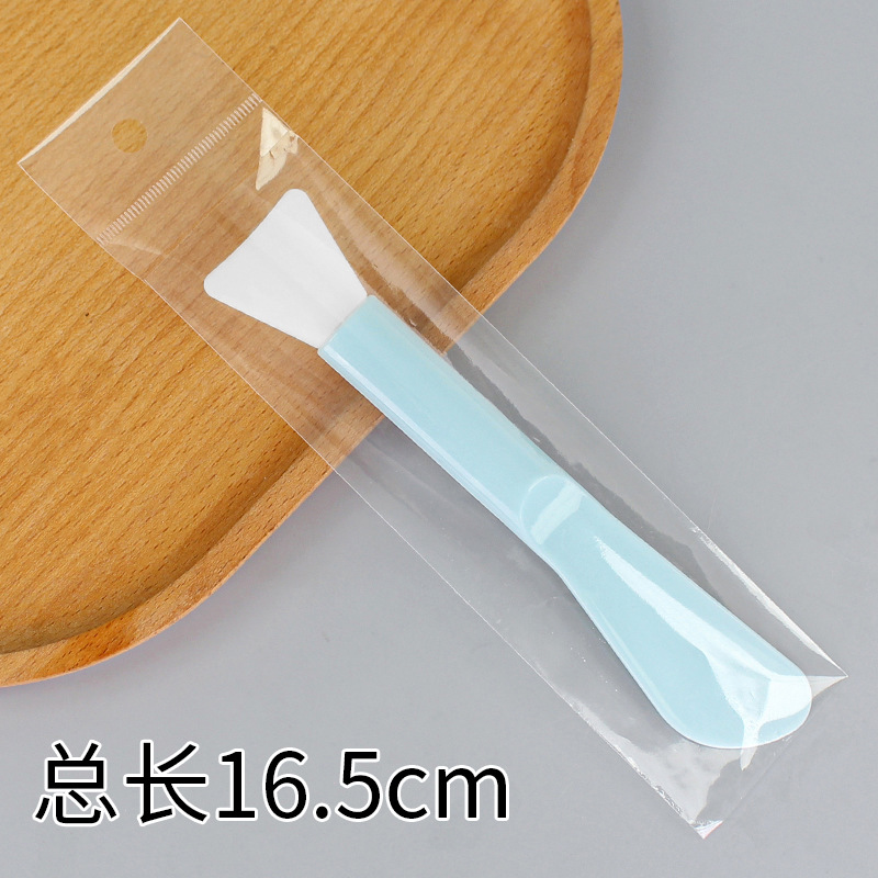 Large double-headed long-handled brush, shovel-shaped, lake blue.